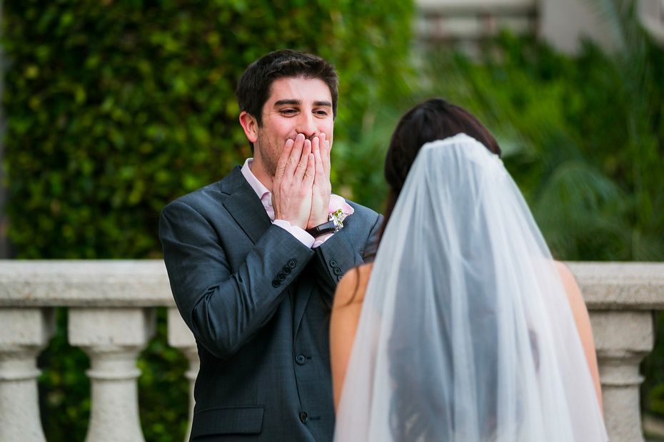 Groom seeing his bride for the first time during a secluded first look at the venue