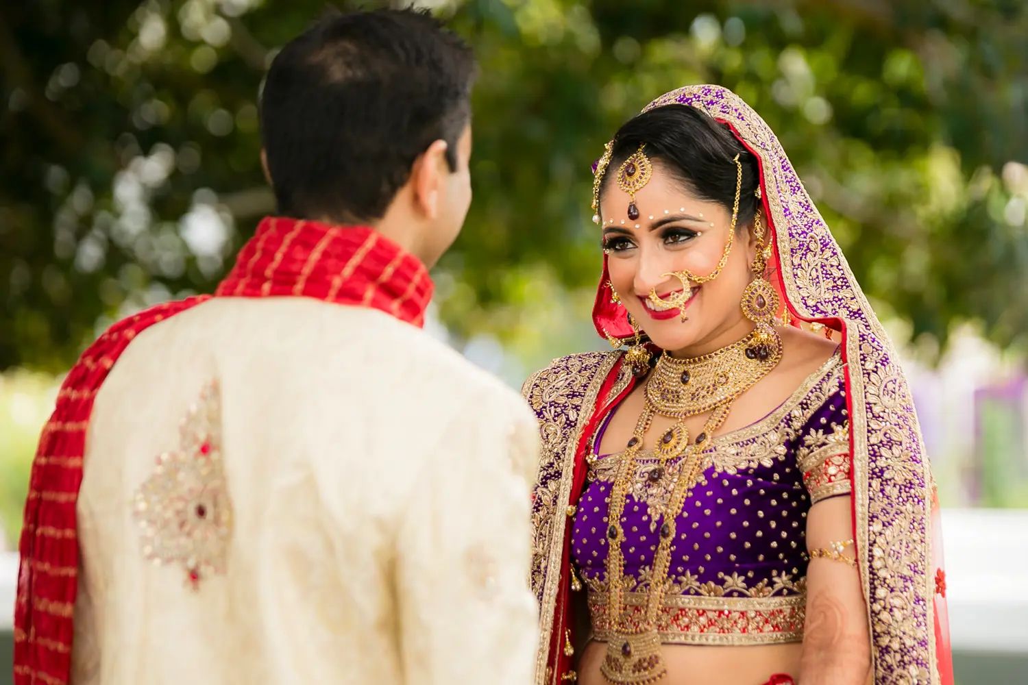 Both bride and groom reactions captured simultaneously during the first look