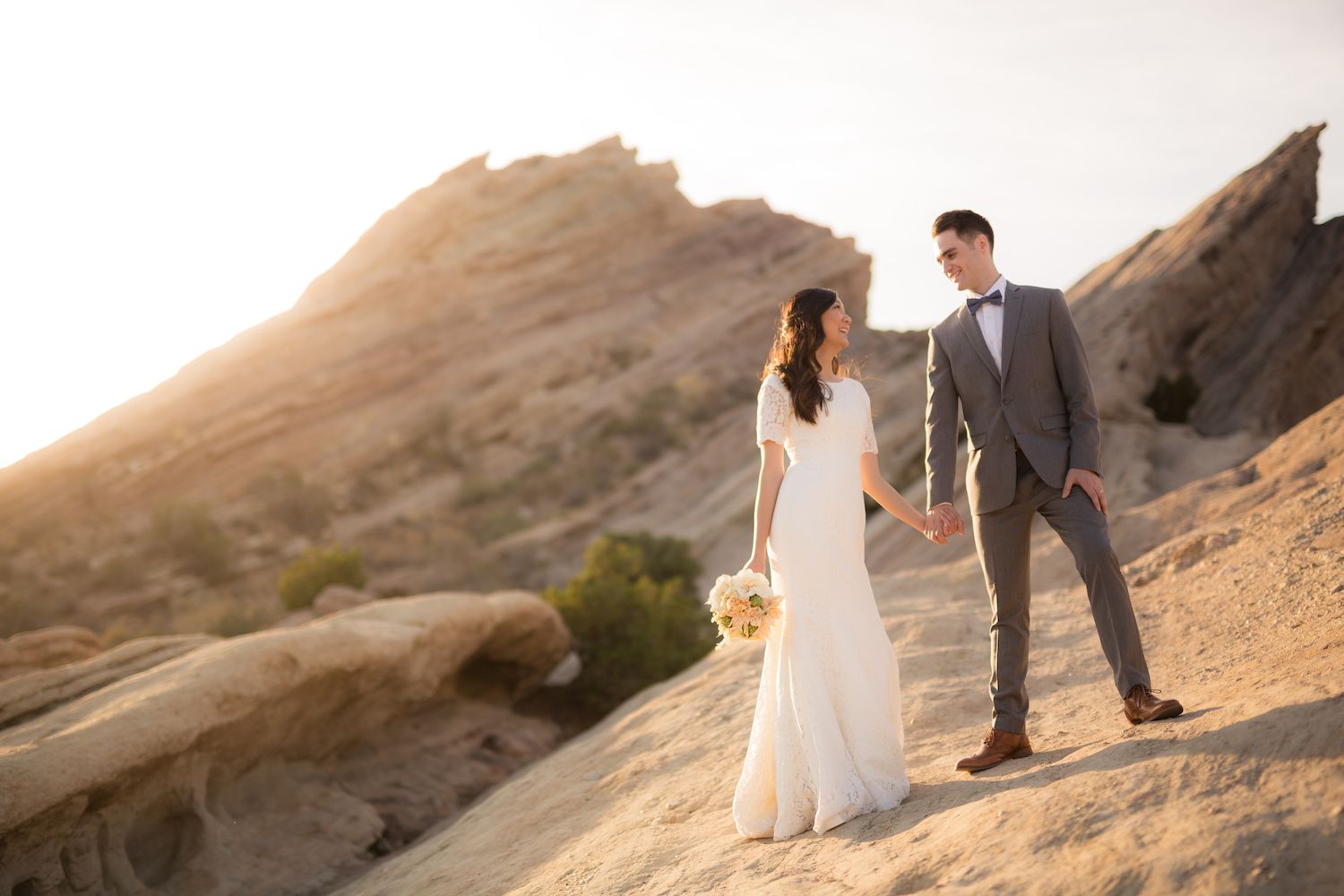 Couple in a movement-based pose during their wedding portrait session