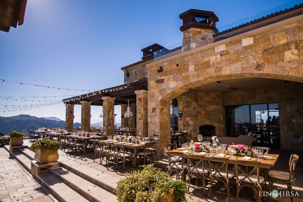 Rustic wedding reception photographs by Lin and Jirsa, outside on the veranda at the Malibu Rocky Oaks Estate in Los Angeles, California