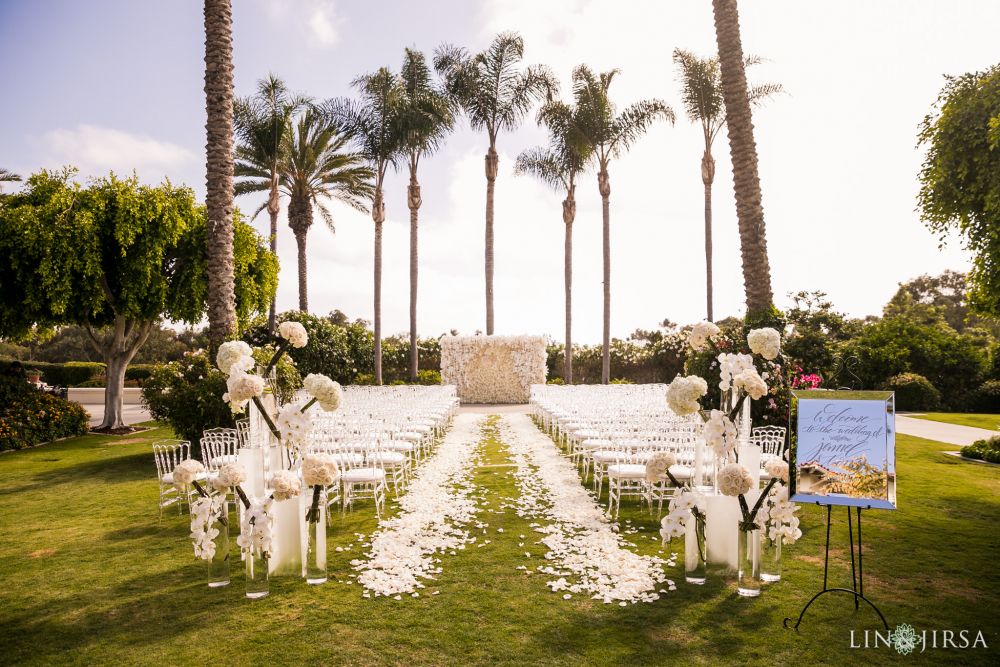 Park Hyatt Aviara San Diego white wedding altar on the lawn with palm trees