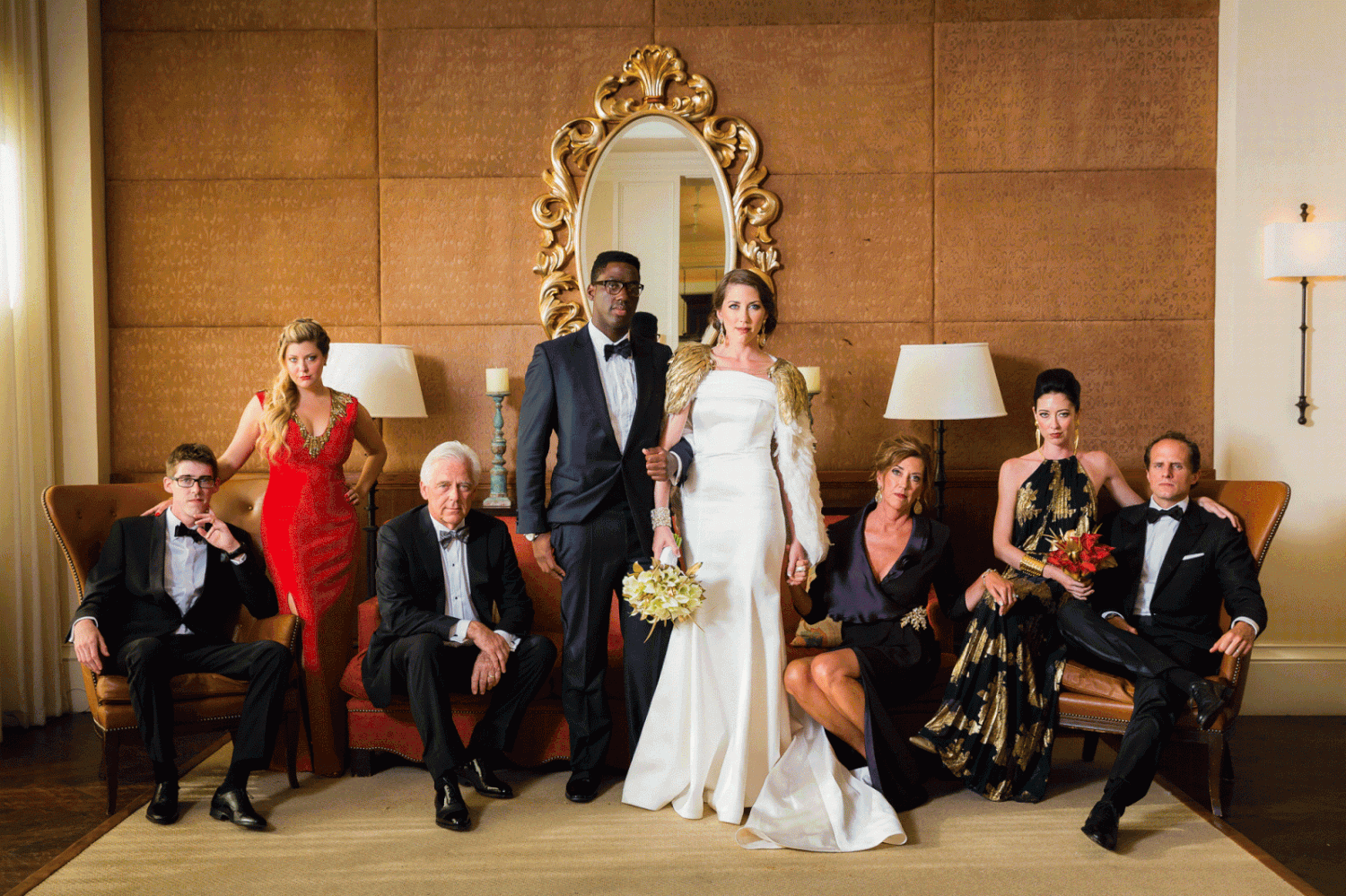 Fun group photo mixed in with traditional family formals at a wedding