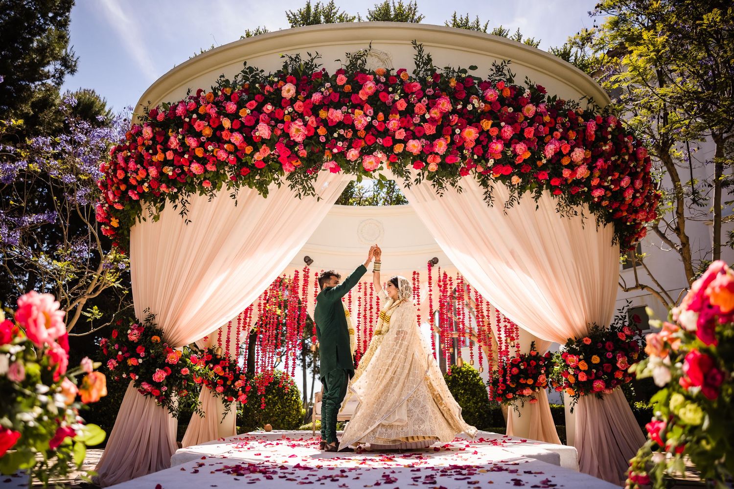 Couple in a movement-based pose during their wedding portrait session, completely natural in front of the camera