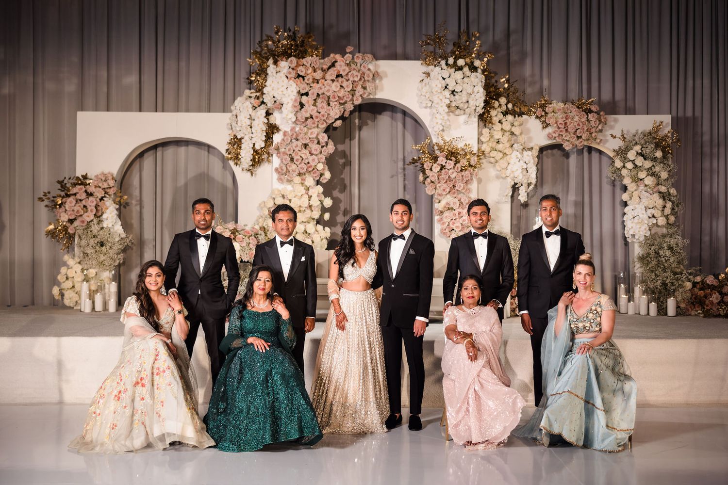 Genuine expressions captured during family formals at a South Asian wedding