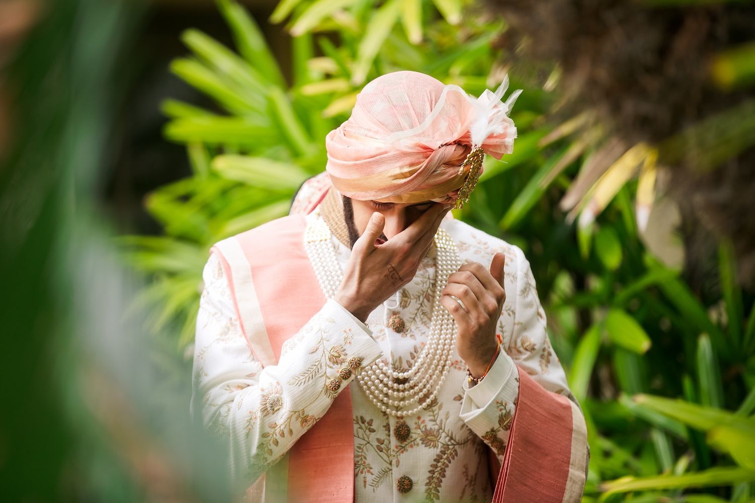Both bride and groom reactions captured simultaneously during the first look at a South Asian wedding