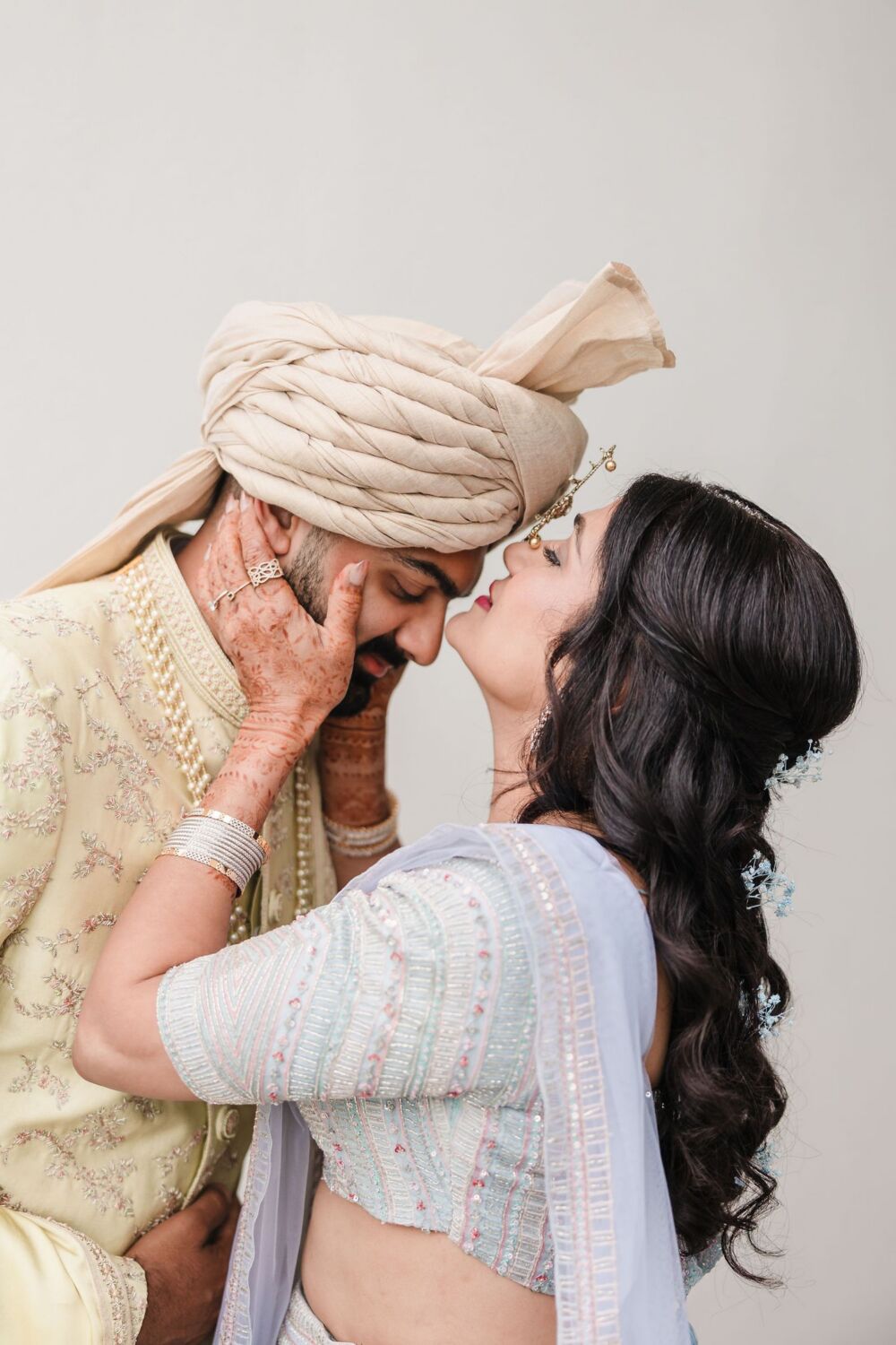 South Asian groom in his sherwani and safa with detail photography of his wedding day attire