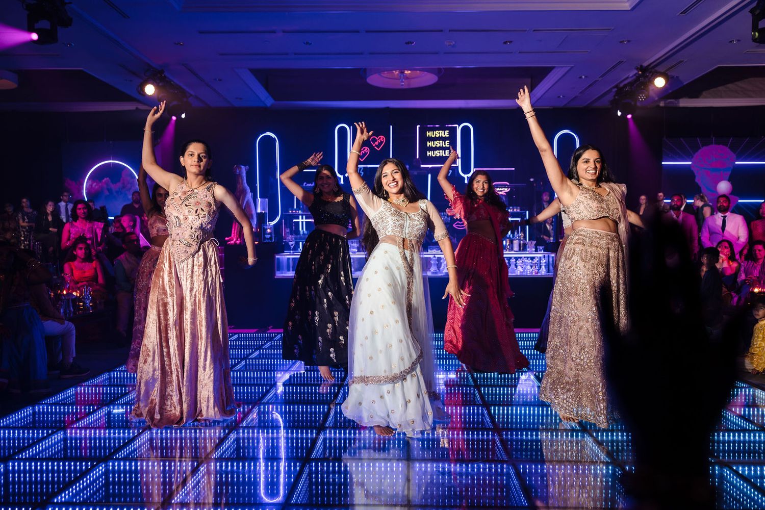 Audience reactions captured alongside the stage performance at the Sangeet